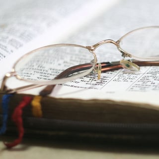 Glasses on Bible