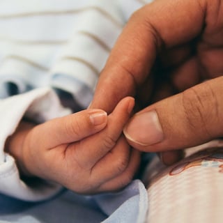 Baby Holding Adult Hand